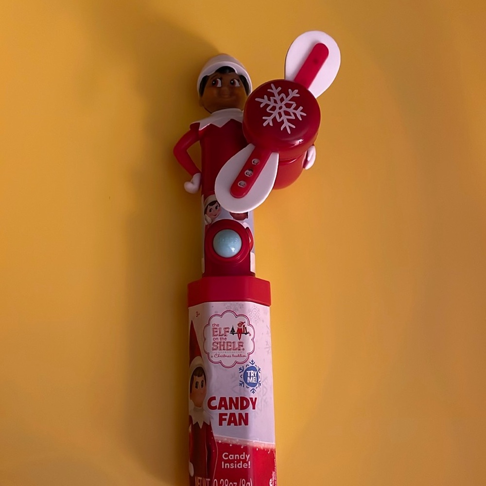 Elf on the Shelf light up spinner toy with candy.